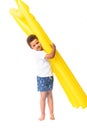 adorable african american boy holding swimming mattress and looking at camera Royalty Free Stock Photo