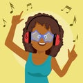 Adorable african american woman singing and having fun listening to music using wireless earphones