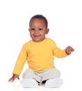 Adorable african baby sitting on the floor Royalty Free Stock Photo