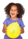 Adorable african little girl with yellow balloon Royalty Free Stock Photo