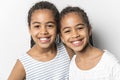 Adorable african twin little girls on studio gray background Royalty Free Stock Photo