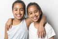 Adorable african twin little girls on studio gray background Royalty Free Stock Photo