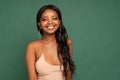 Adorable African young woman looks at the camera with joyful expression and big toothy smile Royalty Free Stock Photo