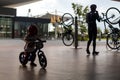 Adorable Asian kid boy Toddler age 1-year-old, Wearing a Safety Helmet and Learning to Ride a Balance Bike in the Play Space Royalty Free Stock Photo