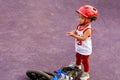 Adorable Asian kid boy Toddler age 1-year-old, Wearing a Safety Helmet and Learning to Ride a Balance Bike in the Play Space Royalty Free Stock Photo