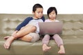 Adorable Asian kids operating a laptop seriously Royalty Free Stock Photo