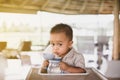 Adorable asian little baby boy drinking water from bottle Royalty Free Stock Photo