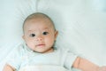 Adorable, Asian newborn. Baby boy looking camera and smile happy face. Royalty Free Stock Photo