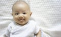 Adorable, Asian newborn. Baby boy looking camera and smile happy face. Royalty Free Stock Photo