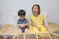 Adorable asian siblings being playful at their home Royalty Free Stock Photo