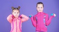 Adorable athletes. Little children developing physical fitness. Small girls enjoy fitness training with weights. Cute Royalty Free Stock Photo