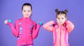 Adorable athletes. Little children developing physical fitness. Small girls enjoy fitness training with weights. Cute Royalty Free Stock Photo