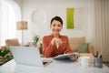 Adorable attractive smart clever young smiling woman working sitting in office at work place work station Royalty Free Stock Photo