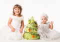 Adorable babies decorating christmas tree. Royalty Free Stock Photo