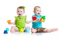 Adorable babies playing with color toys. Children