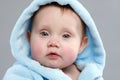 Adorable baby boy in a blue bathrobe Royalty Free Stock Photo