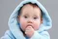 Adorable baby boy in a blue bathrobe Royalty Free Stock Photo