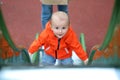 Adorable Baby Boy Climbing Up A Slide Royalty Free Stock Photo