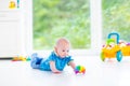 Adorable baby boy with colorful ball and toy car Royalty Free Stock Photo