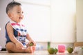 Adorable baby boy enjoying with fruit toy Royalty Free Stock Photo