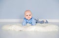 Adorable baby boy laying on the floor in her nursery under the tent Royalty Free Stock Photo