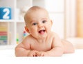 Adorable baby boy lying in bedroom Royalty Free Stock Photo