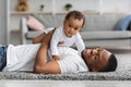 Adorable Baby Boy Lying On Father's Chest While They Relaxing At Home Royalty Free Stock Photo