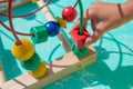 Baby, child playing in nursery. Happy healthy child having fun with colorful toy at home.Colorful toy labyrinth Royalty Free Stock Photo