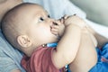 Adorable baby boy sucking his toes Royalty Free Stock Photo