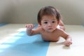 Adorable baby boy trying crawl clamber first time Royalty Free Stock Photo