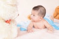 Adorable baby boy in white sunny bedroom. Royalty Free Stock Photo