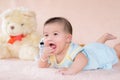 Adorable baby boy in white sunny bedroom. Royalty Free Stock Photo