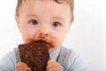 Adorable baby eating chocolate Royalty Free Stock Photo