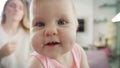 Adorable baby face looking in camera. Portrait of happy child exploring world