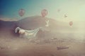 Adorable baby flying with balloons in a valley