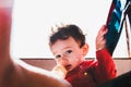 Adorable baby girl drinking milk from her bottle isolated outdoors Royalty Free Stock Photo