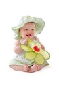 Adorable baby girl holds her toy flower Royalty Free Stock Photo