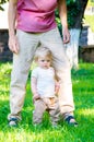 Adorable baby girl making first steps Royalty Free Stock Photo