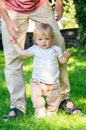 Adorable baby girl making first steps Royalty Free Stock Photo