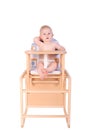 Adorable baby in high chair isolated