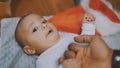 Adorable baby holding father hand. Mulatto baby playing with fathers hand. close up Royalty Free Stock Photo