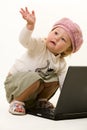 Adorable baby with laptop Royalty Free Stock Photo