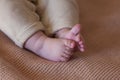 Adorable baby legs, Newborn baby feet, babyhood concept.