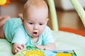 Adorable baby looking a book Royalty Free Stock Photo