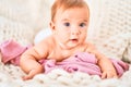 Adorable baby lying down over blanket on the sofa at home Royalty Free Stock Photo