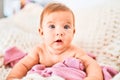 Adorable baby lying down over blanket on the sofa at home Royalty Free Stock Photo