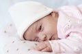 Adorable baby newborn sleeping on stomach on a soft blanket. A newborn baby in a hat sleeps on a soft blanket Royalty Free Stock Photo