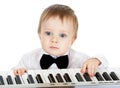 Adorable baby playing electronic piano