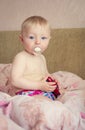 Adorable baby playing with a toy car Royalty Free Stock Photo