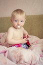 Adorable baby playing with a toy car Royalty Free Stock Photo